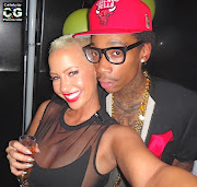 Amber Rose / Wiz Khalifa. Amber & Wiz chilling at her early BDay celebration .