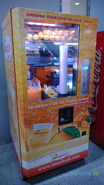 Orange juice vending machine at Kamppi Kauppakeskus