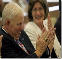 ANN WILLIAMSON/THE CAPITAL-JOURNAL
Judge Matthew Dowd and his wife Judy clap at the end of his retirement ceremony  Friday at the Shawnee County Courthouse. 