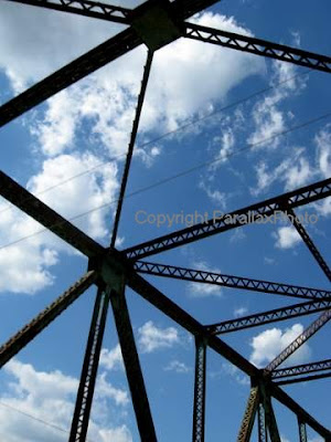 abstract photograph metal bridge blue sky