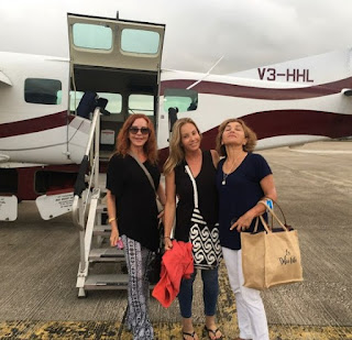 Jacklyn Zeman posing for photo with her friends while private jet in the background