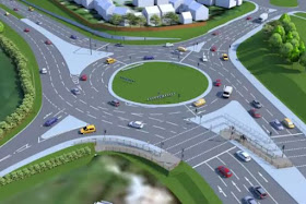 A roundabout without much traffic on it