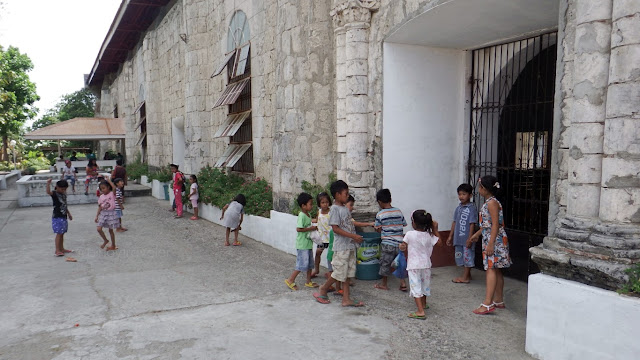 children playing outside the Guimbal Church Iloilo