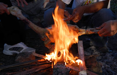 pinikpikan - burning chicken feathers to remove the feathers