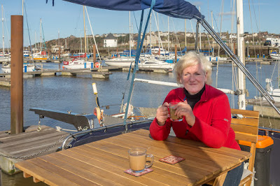 Photo of me enjoying a coffee on our new aft deck furniture