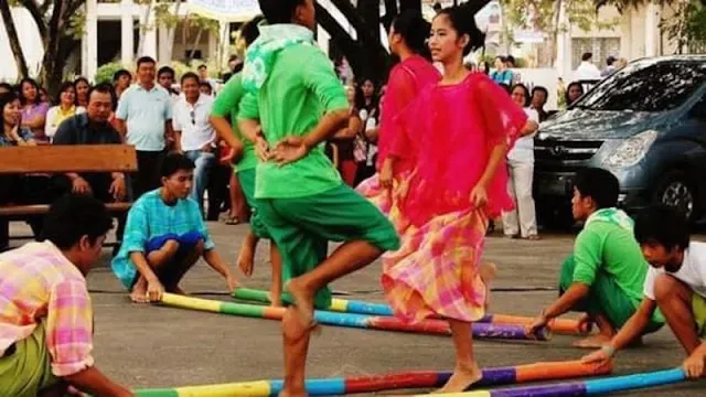 What is the Traditional Folk Dance Often Performed During Festive Occasions in the Philippines? It's the Bamboo-tastic Tinikling!