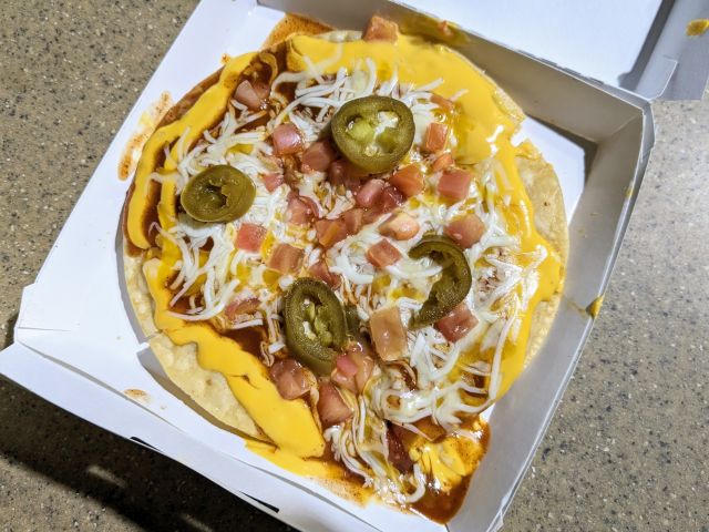 Taco Bell Cheesy Jalapeño Mexican Pizza top-down view.