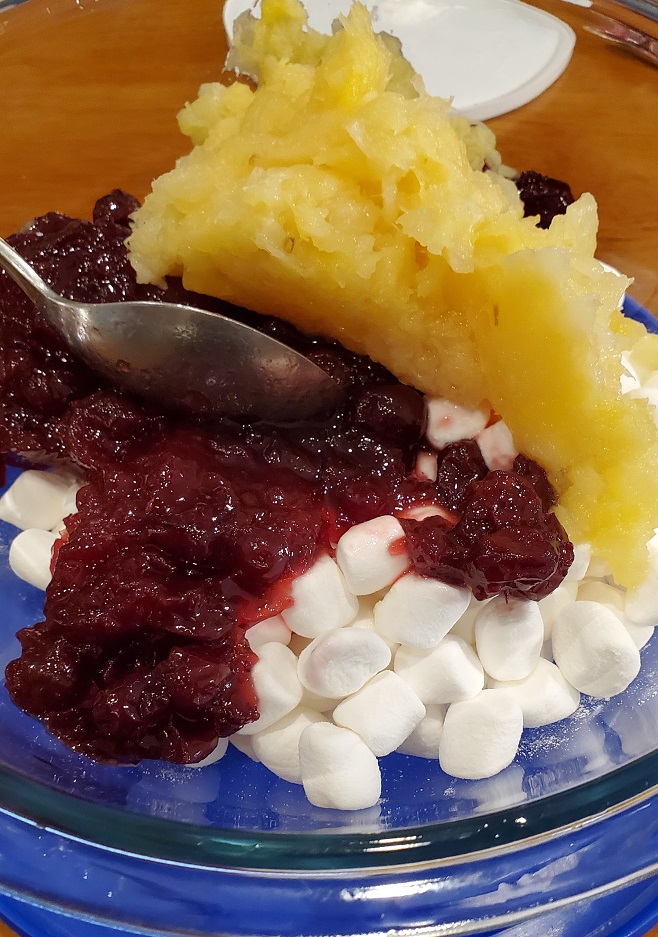 mixture of whole cranberries in a fruit salad