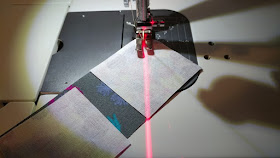 Using a laser to sew quilt blocks