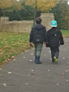 Two Boys Walking Away into Distance