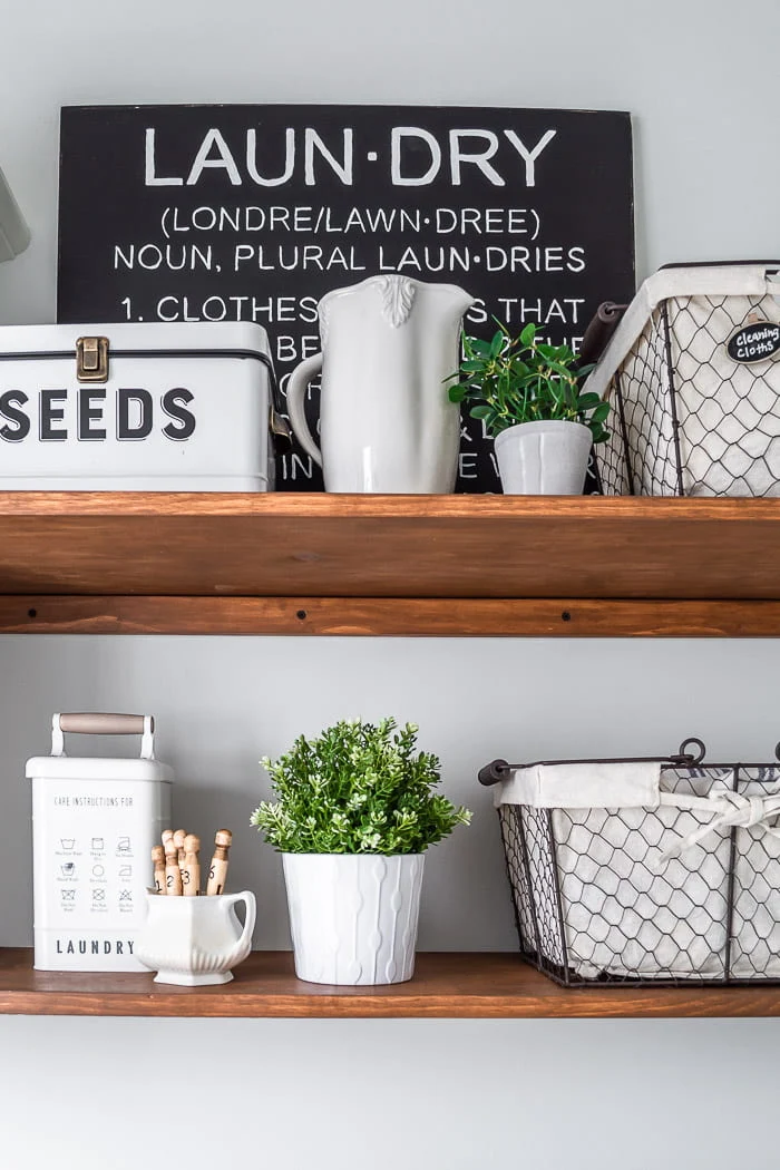 decorated laundry room shelves, black and white