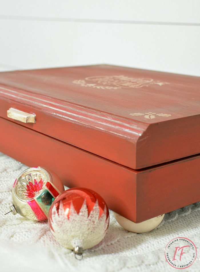 How to upcycle a thrift store flatware box into a festive red Christmas Box and how to line the inside with a flannel shirt for Santa on Christmas Eve.