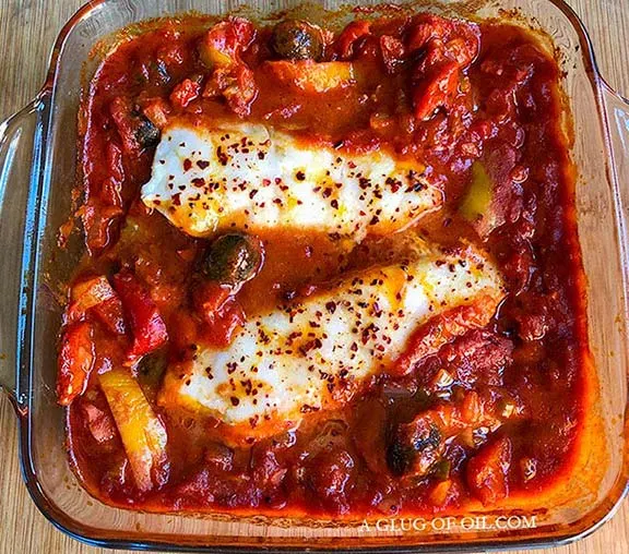 Baked cod with tomato sauce.