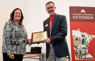 Lee Johnston accepting his award from Dean Durgan.