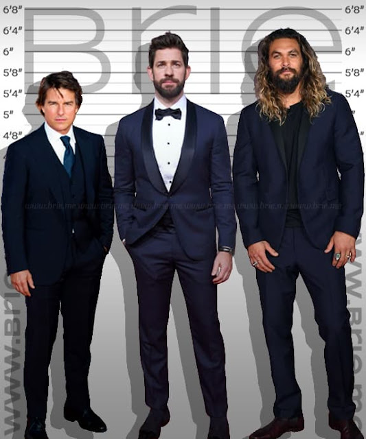 John Krasinski standing with Tom Cruise and Jason Momoa