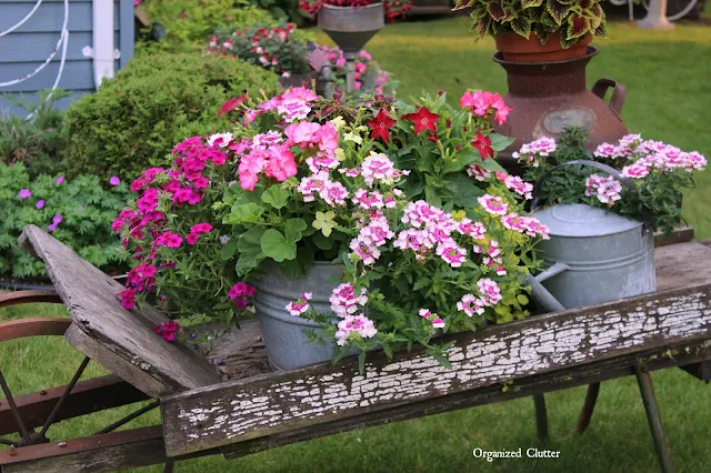 Rustic Garden Wheelbarrow & Laundry Tub Planter Ideas www.organizedclutter.net