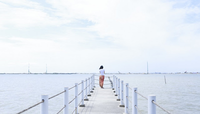 Girl standing alone in disappointment and depression.