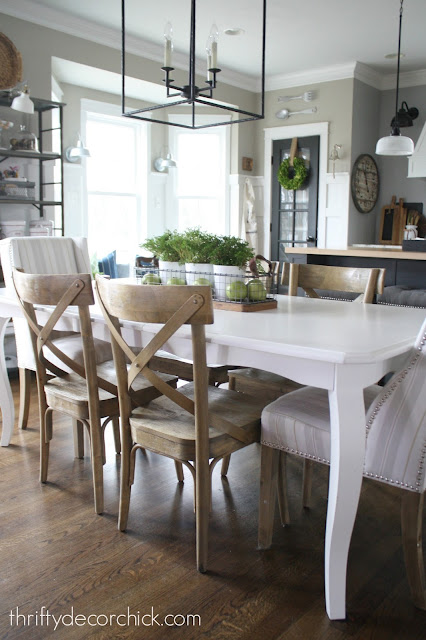 White kitchen table with wood chairs