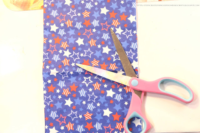 Decorative star napkin and scissors on a table