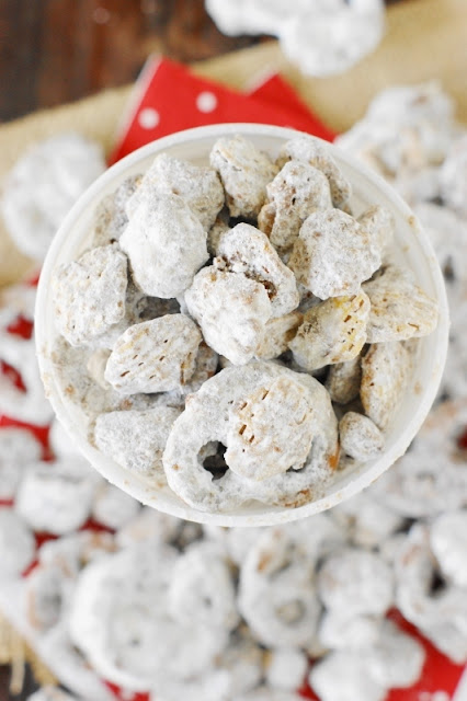 Puppy Chow {or Yuppy Chow} ~ Covered in chocolaty goodness & powdered sugar, it's a classic sweet treat ... perfect for everyday snacking or Christmas gift giving.  Freezer-friendly, too, for make-ahead convenience.   www.thekitchenismyplayground.com