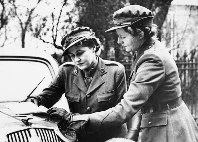 Women of the MTC - An MTC girl gets her orders from her superior on the bonnet of her car