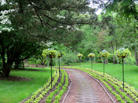 walkway lined with flowers Dow Gardens