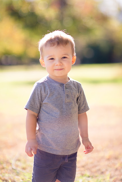 Two-year old has a slight grin and looking curiously at me.  Is it time to play?  Taken at their home in Shawnee, OK.