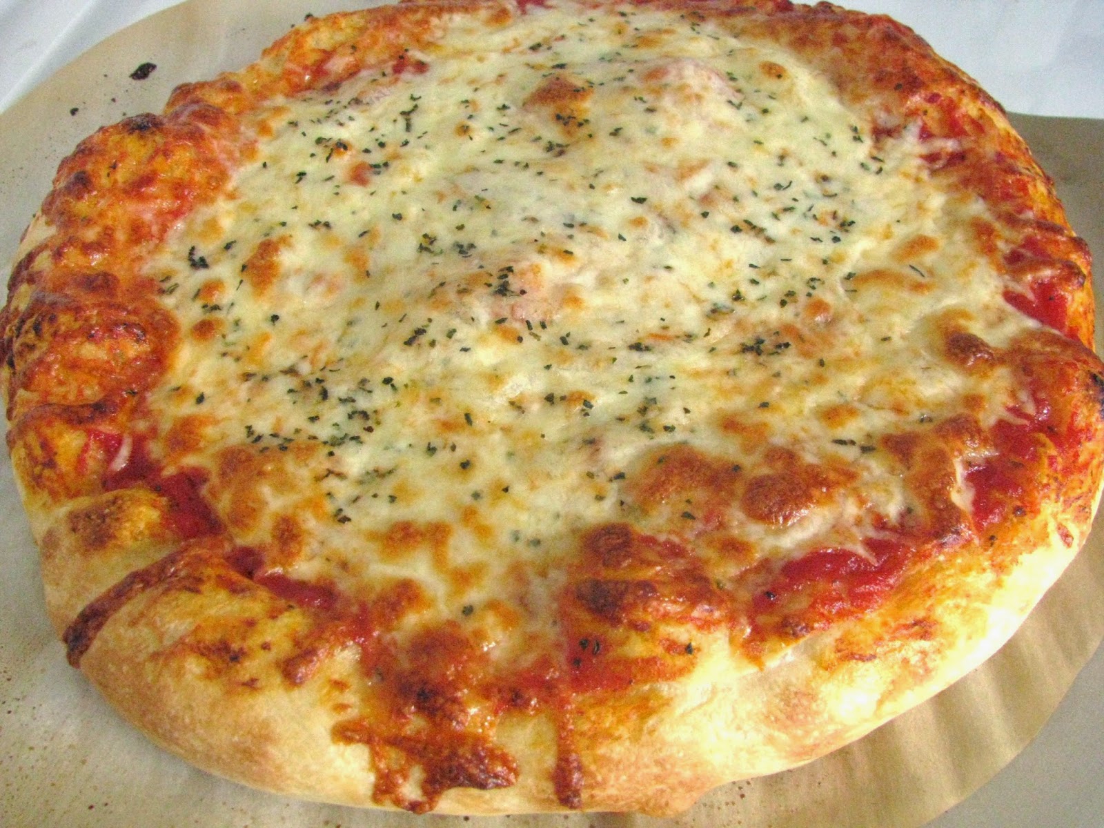 http://stickafork.net/2011/02/how-to-make-homemade-pizza/