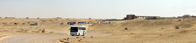 A pyramid appears in the distance.