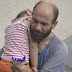 Refugee earns $17k after pics of him selling pens while carrying sleeping daughter goes viral 