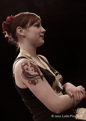 Young woman with tattoo art on sectioned arm back and other body part
