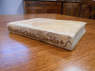 A photograph of a book with a limp vellum binding.