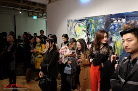 Art lovers listening to the opening night speeches - Beyond the Light - Chinese Artist He Zige - Photos By Kent Johnson for Street Fashion Sydney.