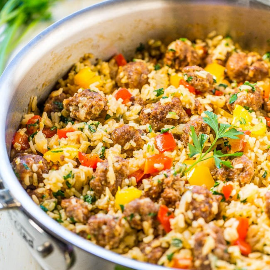 Peppers, sausage, onions and rice in a pan