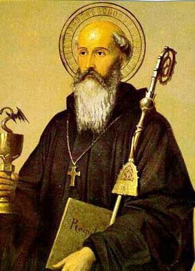 En la imagen San Benito con el baculo, el libro de la Regla Monastica y la copa envenenada.