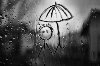 Rainy day image in a wet window