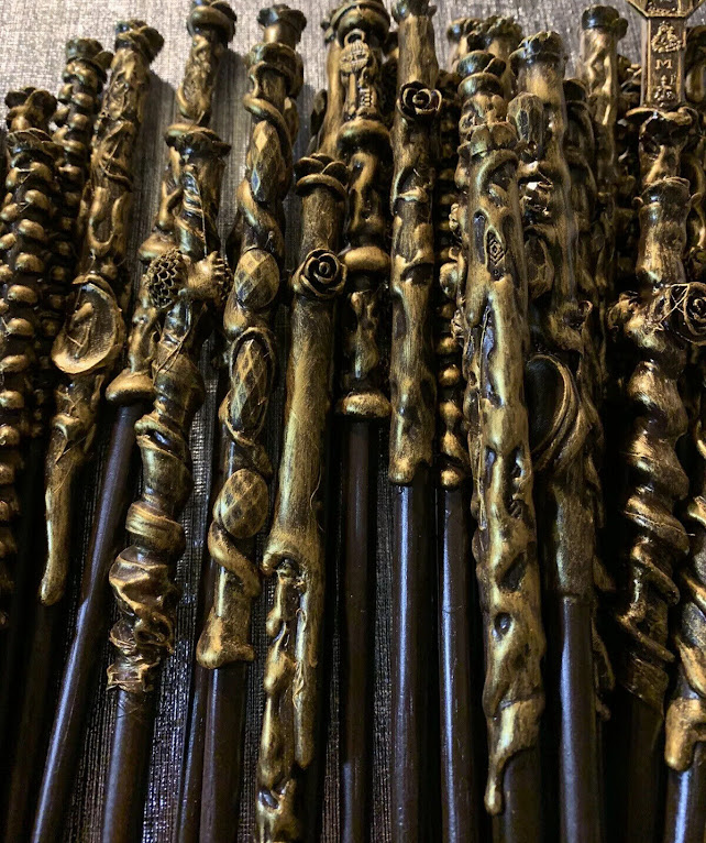 Showing black colour wands with golden colour head.