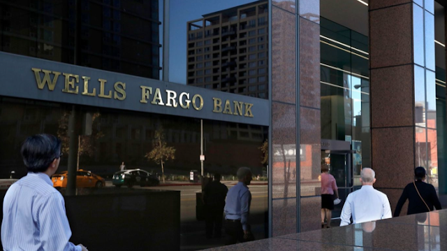 Wells Fargo shares hammered by investors after unprecedented punishment by Federal Reserve
