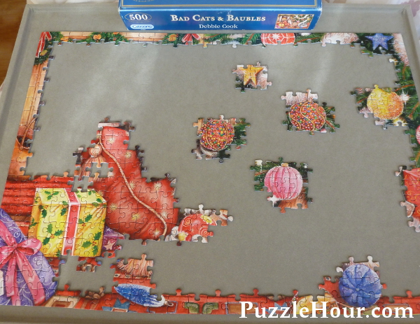 Working on a 500 piece Gibsons jigsaw puzzle Bad Cats and Baubles