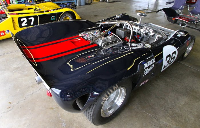 Archie Urciuoli above suits up to drive his 36 Lola T70 Spyder left