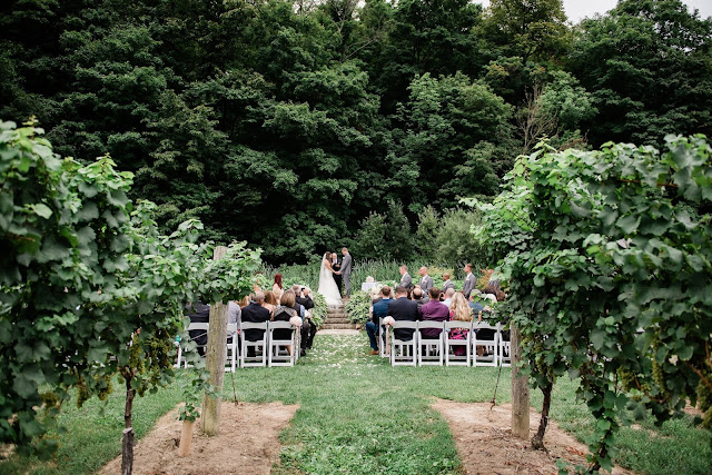 Niagara Wedding Planner - A Divine Affair - Alyssa and Steve - Photo by Gemini Photography. Ceremony outside at the escarpment at Cave Springs Vineyard in Jordan. Reception at Inn on the Twenty with blush and gold decor. Ivory and blush flowers. 