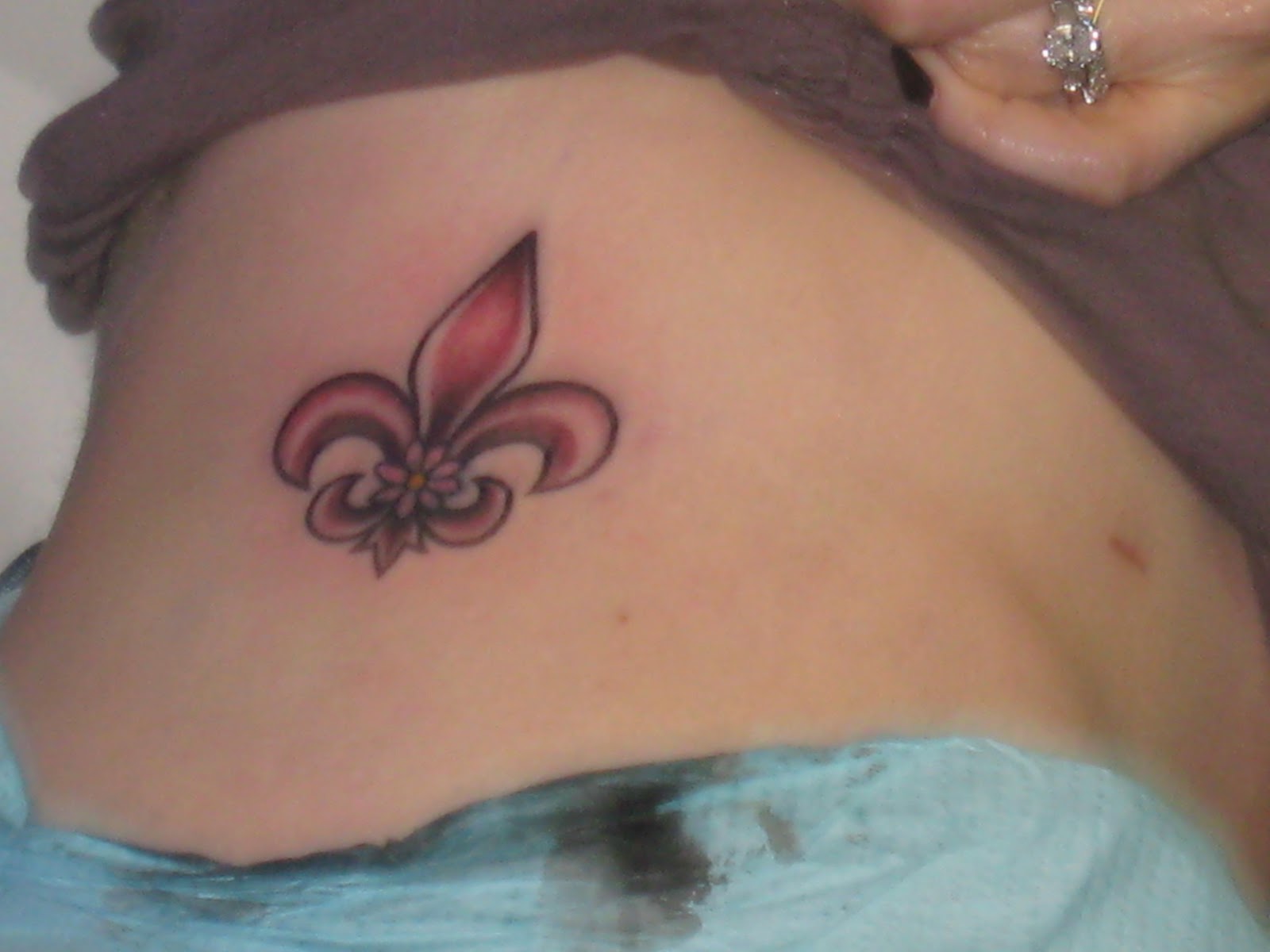 AFTER fleur de lis tattoo