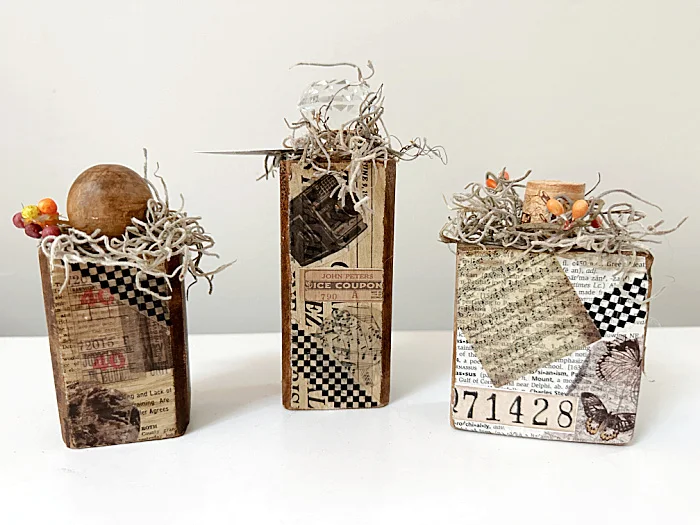 group of ephemera pumpkins with stems and moss