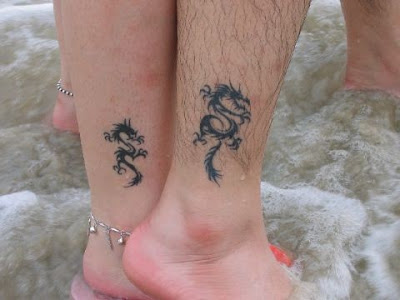 A very cool tattoo design with two dragons This tattoo also looks like a 