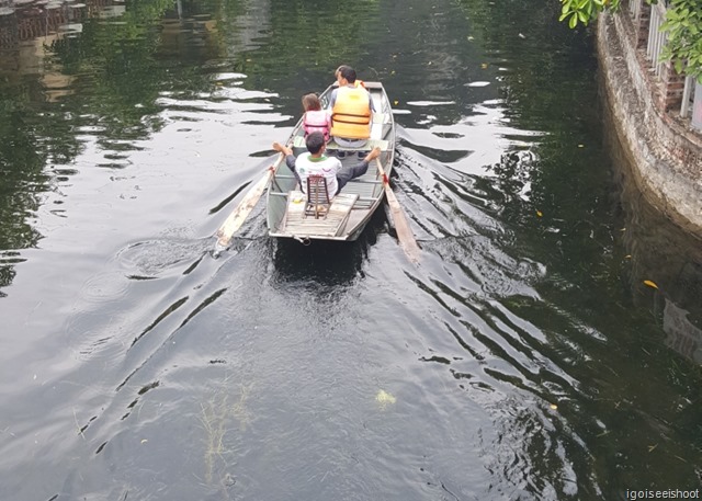 Tam Coc Boat Tour.  Ninh Binh, Rower using feet.