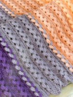 https://www.lovecrochet.com/loop-stitch-braid-baby-blanket-crochet-pattern-by-happyberry-crochet