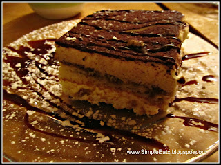 Tiramisu with fudge drizzled on