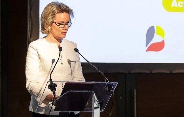 Queen Mathilde and Minister Meryame Kitir attended an event of The Shift. Queen Mathilde wore a white jacket by Armani