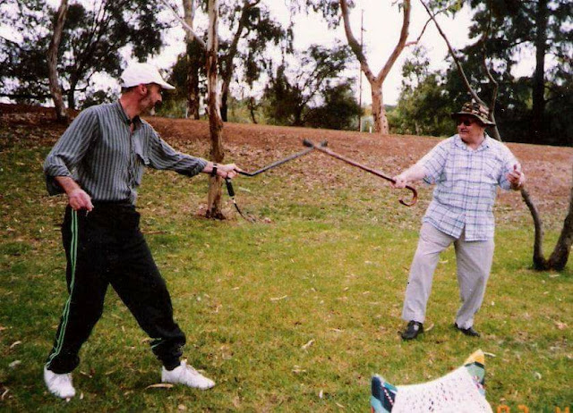 Robert Middleton and Raymond Middleton Fighting with walking sticks