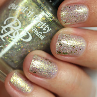 shimmery white nail polish that shifts to green and gold